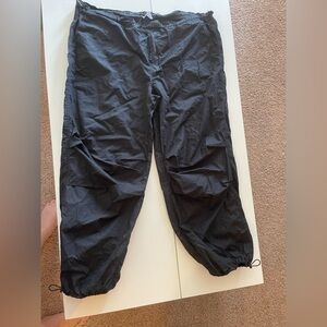 Large, abound, black parachute pants